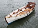 Phoenix - A rare opportunity to acquire a class rowing skiff fully restored & with sweeps & a custom trailer.