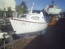 Osprey - A neat & tidy "nippy" fishing or pleasure boat with 2 berth cabin, custom trailer, 9.9 engine & various equipment.