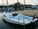 Domino - A good example of these very popular sturdily built 2 berth sailing cruisers with a Honda engine & a custom trailer.