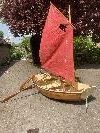 Nutty - These are very "pretty" & versatile dinghies with a simple sailing rig, trolly, oars etc. Can take a small engine