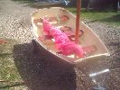 Nutty - These are very "pretty" & versatile dinghies with a simple sailing rig, trolly, oars etc. Can take a small engine